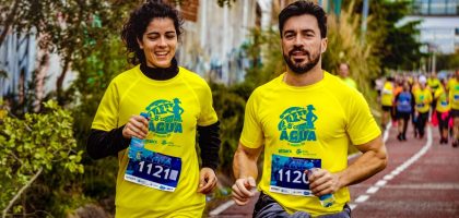 Two athletes participating in a marathon, showing determination and joy.